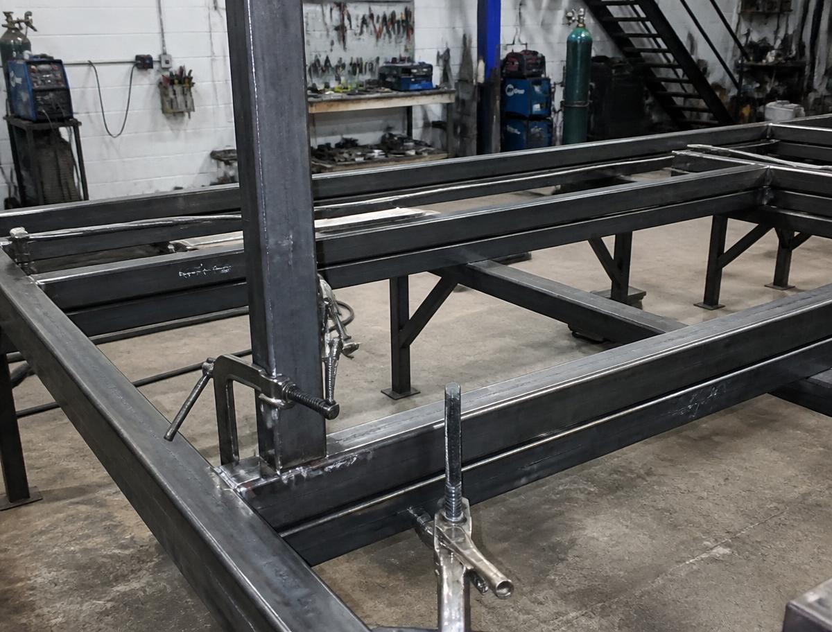 Fabricated steel frame squared up on the bench before welding